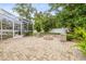 Beautiful backyard with a patio, pool, and lush landscaping, perfect for relaxation and outdoor enjoyment at 204 S Trask St, Tampa, FL 33609