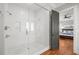 Modern bathroom featuring a glass shower with dual showerheads and a doorway leading into the bedroom at 204 S Trask St, Tampa, FL 33609