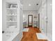 Bathroom showcasing a modern glass shower, bathtub, vanity area, and wood flooring at 204 S Trask St, Tampa, FL 33609
