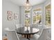 Cozy breakfast nook with a view of the pool area and outdoor living space through large windows at 204 S Trask St, Tampa, FL 33609