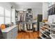Organized walk-in closet with custom shelving, clothing racks, and drawers for maximum storage at 204 S Trask St, Tampa, FL 33609