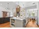 Modern kitchen open to the living area, featuring a large island and stainless steel appliances at 204 S Trask St, Tampa, FL 33609