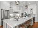 Bright, spacious kitchen with white cabinetry, stainless steel appliances, and a large island at 204 S Trask St, Tampa, FL 33609