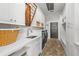 Functional laundry room featuring cabinets, sink, and new washer and dryer at 204 S Trask St, Tampa, FL 33609