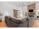 Cozy living room boasting a stone fireplace, barn door, hardwood floors, and ample seating at 204 S Trask St, Tampa, FL 33609