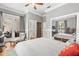 Spacious bedroom with hardwood floors, a lounging chair and a mirrored closet at 204 S Trask St, Tampa, FL 33609