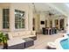 Inviting outdoor patio featuring a dining area, lounge seating, and pool access, perfect for relaxation at 204 S Trask St, Tampa, FL 33609