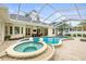 Expansive backyard featuring a pool, spa, and patio area, perfect for entertaining and outdoor living at 204 S Trask St, Tampa, FL 33609