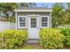 Charming shed surrounded by colorful landscaping, adding character to the backyard at 204 S Trask St, Tampa, FL 33609