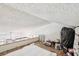 Cozy attic with wood floors, white walls, and natural lighting at 20921 Haulover Cv # 8, Lutz, FL 33558