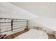 Cozy attic with wood floors, white walls, and natural lighting at 20921 Haulover Cv # 8, Lutz, FL 33558