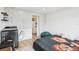 Bedroom features natural light, hardwood floors, laundry area, and ensuite access at 20921 Haulover Cv # 8, Lutz, FL 33558