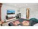 Bedroom features natural light, hardwood floors, laundry area, and ensuite access at 20921 Haulover Cv # 8, Lutz, FL 33558