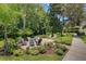 Community courtyard with seating, beautiful landscaping, offering a relaxing outdoor space at 20921 Haulover Cv # 8, Lutz, FL 33558