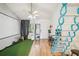 Open living area showcasing unique ladder, hardwood floors and bright lighting at 20921 Haulover Cv # 8, Lutz, FL 33558