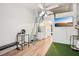 Cozy living space with wood floors, artificial turf and unique ladder access at 20921 Haulover Cv # 8, Lutz, FL 33558