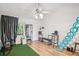 Bright condo living room featuring hardwood floors and outdoor view at 20921 Haulover Cv # 8, Lutz, FL 33558