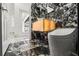 Modern bathroom with marble accent wall and floors, and luxurious features at 2238 Shirecrest Cove Way, Lutz, FL 33558