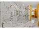 Luxurious bathroom with marble tile, glass shower, and modern fixtures at 2238 Shirecrest Cove Way, Lutz, FL 33558