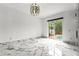 Bright bedroom with marble flooring and sliding glass doors to screened-in pool area at 2238 Shirecrest Cove Way, Lutz, FL 33558