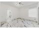 Minimalist bedroom featuring modern lighting, marble floors and bright natural light at 2238 Shirecrest Cove Way, Lutz, FL 33558