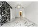 Spacious bedroom with marble floors and an open doorway to the walk-in closet at 2238 Shirecrest Cove Way, Lutz, FL 33558