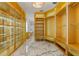 Bright and spacious walk-in closet featuring custom built-in shelving at 2238 Shirecrest Cove Way, Lutz, FL 33558