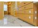 Spacious walk-in closet with custom shelving, drawers, and marble flooring at 2238 Shirecrest Cove Way, Lutz, FL 33558