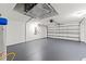 Spacious two car garage with epoxy flooring and automatic door opener at 2238 Shirecrest Cove Way, Lutz, FL 33558