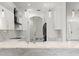 Bright open kitchen featuring marble countertops and floors with stainless hardware at 2238 Shirecrest Cove Way, Lutz, FL 33558