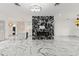 Spacious living room featuring a modern fireplace and elegant marble floors at 2238 Shirecrest Cove Way, Lutz, FL 33558