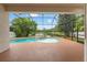 Screened-in pool with a lovely lake view at 2238 Shirecrest Cove Way, Lutz, FL 33558