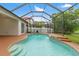 Gorgeous screened-in pool area with water feature and ample deck space at 2238 Shirecrest Cove Way, Lutz, FL 33558