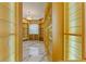 Spacious walk-in closet featuring custom shelving, glass shelves, and marble flooring at 2238 Shirecrest Cove Way, Lutz, FL 33558