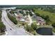 Aerial view of home with a private pool, nestled among lush greenery and trees at 22755 Cypress Trail Dr, Lutz, FL 33549