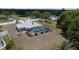 Aerial view of house featuring the screened-in pool and well-maintained landscaping at 22755 Cypress Trail Dr, Lutz, FL 33549
