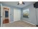A cozy bedroom with soft carpet, a double closet, and a bright window for natural light at 22755 Cypress Trail Dr, Lutz, FL 33549