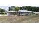 Exterior of home with well-manicured lawn and neatly arranged landscaping at 22755 Cypress Trail Dr, Lutz, FL 33549