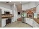 Updated kitchen with granite countertops, stainless steel appliances, and an open layout flowing into the living space at 22755 Cypress Trail Dr, Lutz, FL 33549