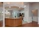 Open concept kitchen features a breakfast bar, stainless steel appliances, and access to other rooms at 22755 Cypress Trail Dr, Lutz, FL 33549