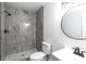 Beautiful bathroom with a tile shower, a new toilet and updated vanity with modern fixtures at 2324 W Marquette Ave, Tampa, FL 33604