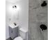 Modern bathroom features sleek, gray tile and updated fixtures at 2324 W Marquette Ave, Tampa, FL 33604