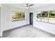 Light-filled bedroom with natural lighting, neutral color palette, and hardwood floors at 2324 W Marquette Ave, Tampa, FL 33604