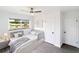 Cozy bedroom with ceiling fan, natural light, and hardwood floors at 2324 W Marquette Ave, Tampa, FL 33604