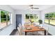 Bright dining room with large windows, table set, and modern décor at 2324 W Marquette Ave, Tampa, FL 33604