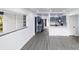 Modern kitchen with gray cabinets, quartz counters, stainless appliances, and hard surface floors at 2324 W Marquette Ave, Tampa, FL 33604