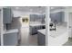 Bright kitchen featuring gray cabinetry, quartz countertops, and stainless steel appliances at 2324 W Marquette Ave, Tampa, FL 33604
