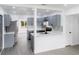 Stylish kitchen features gray cabinets, stainless appliances, and breakfast bar at 2324 W Marquette Ave, Tampa, FL 33604