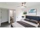 Comfortable main bedroom with ceiling fan and ample natural light at 2324 W Marquette Ave, Tampa, FL 33604