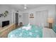 Cozy bedroom with floral bedding, woven dresser, and well-lit closet space at 24 Gulf Blvd # 1C, Indian Rocks Beach, FL 33785